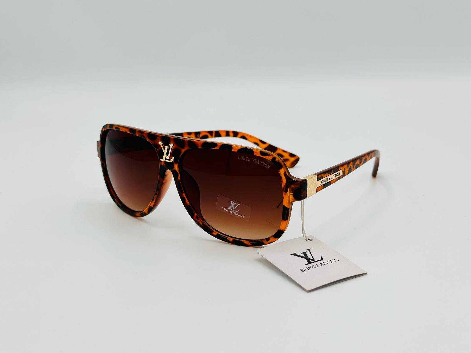 Tortoiseshell sunglasses with brown gradient lenses and gold side detail