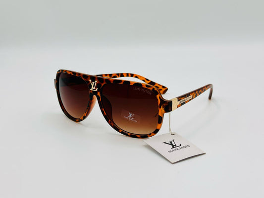 Tortoiseshell sunglasses with brown gradient lenses and gold side detail