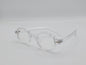 Transparent round eyeglass frame with clear arms and minimal design.