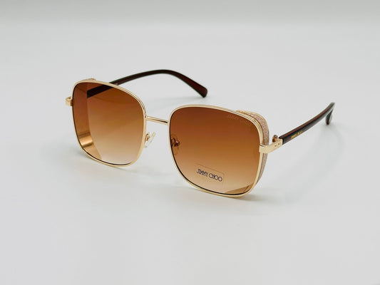Elegant gold square sunglasses with brown gradient lenses and glittery side detail 
