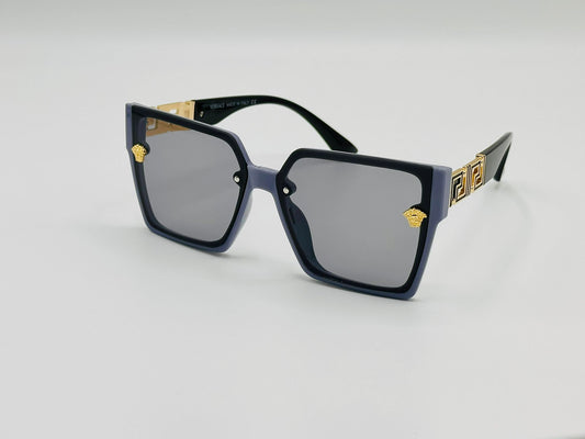 Oversized square sunglasses with black frame and gold detailing on temples